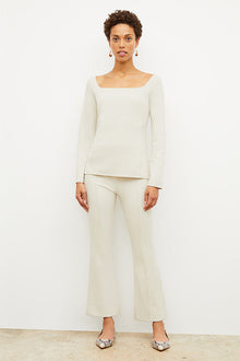 Front image of a woman wearing the jace top in pearl | Exclude | Grid