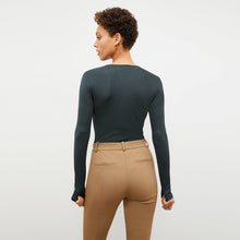 Back image of a woman standing wearing the Curie Pant—Everstretch in Saddle