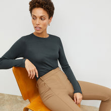 Front image of a woman standing wearing the Curie Pant—Everstretch in Saddle