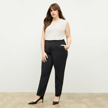 Front image of a woman wearing the Emmy Top in Alabaster