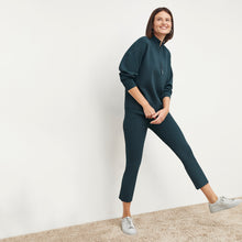Front image of a woman standing wearing the Finley Legging—Ribbed Jardigan Knit in Deep Sea | Lead
