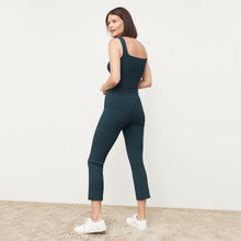 Back image of a woman standing wearing the Finley Legging—Ribbed Jardigan Knit in Deep Sea
