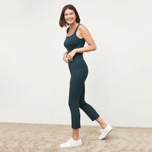 Side image of a woman standing wearing the Finley Legging—Ribbed Jardigan Knit in Deep Sea